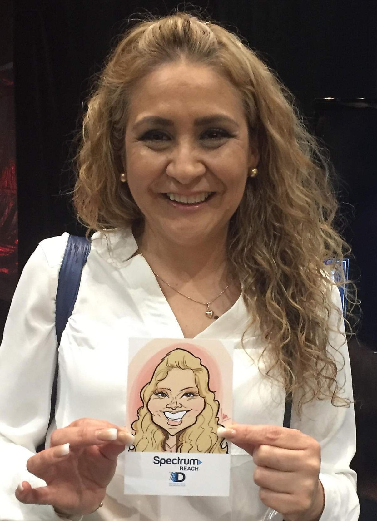 A happy woman displaying her caricature art print